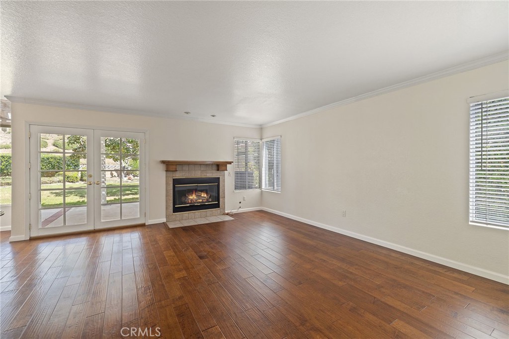 28974 Clear Spring Lane Highland, CA 92346 - Photo 27 of 65 Family room with french doors that open to the outside. The fireplace is digitally enhanced
