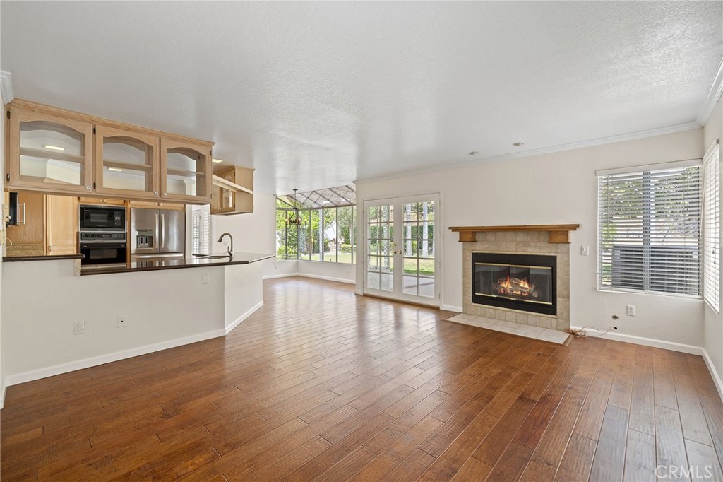 28974 Clear Spring Lane Highland, CA 92346 - Photo 65 of 65 Family room and kitchen open floor plan, Fireplace digitially enhanced