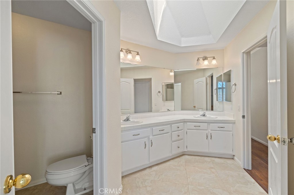 28974 Clear Spring Lane Highland, CA 92346 - Photo 40 of 65 Upstairs bathroom with 2 sinks, bathrub with shower