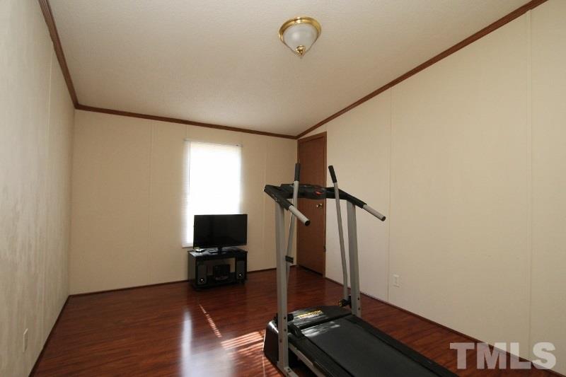 350 Big Pine Road Clayton, NC 27520 - Photo 13 of 20 a view of a workspace with wooden floor