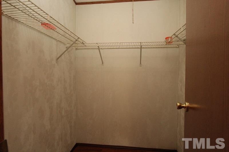 350 Big Pine Road Clayton, NC 27520 - Photo 18 of 20 a view of small space with racks on the wall