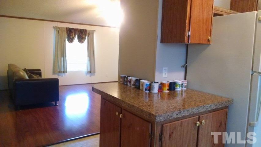 350 Big Pine Road Clayton, NC 27520 - Photo 4 of 20 a kitchen with sink and a window