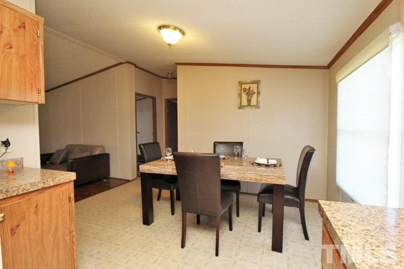 350 Big Pine Road Clayton, NC 27520 - Photo 5 of 20 a view of a dining room with furniture