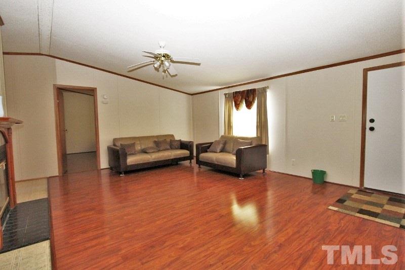 350 Big Pine Road Clayton, NC 27520 - Photo 8 of 20 a living room with furniture and a wooden floor