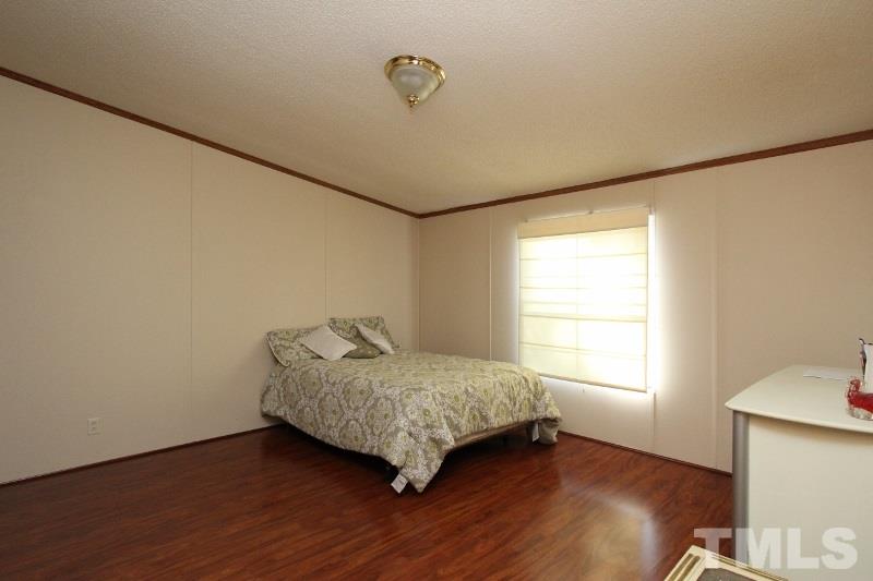 350 Big Pine Road Clayton, NC 27520 - Photo 9 of 20 a room with a bed and a window