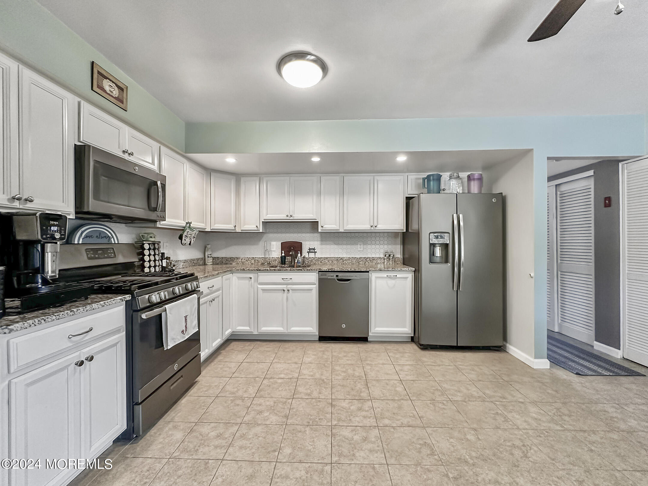 1002 Sawmill Road Brick, NJ 08724 - Photo 11 of 27 a kitchen with stainless steel appliances granite countertop a refrigerator a stove top oven a sink and dishwasher