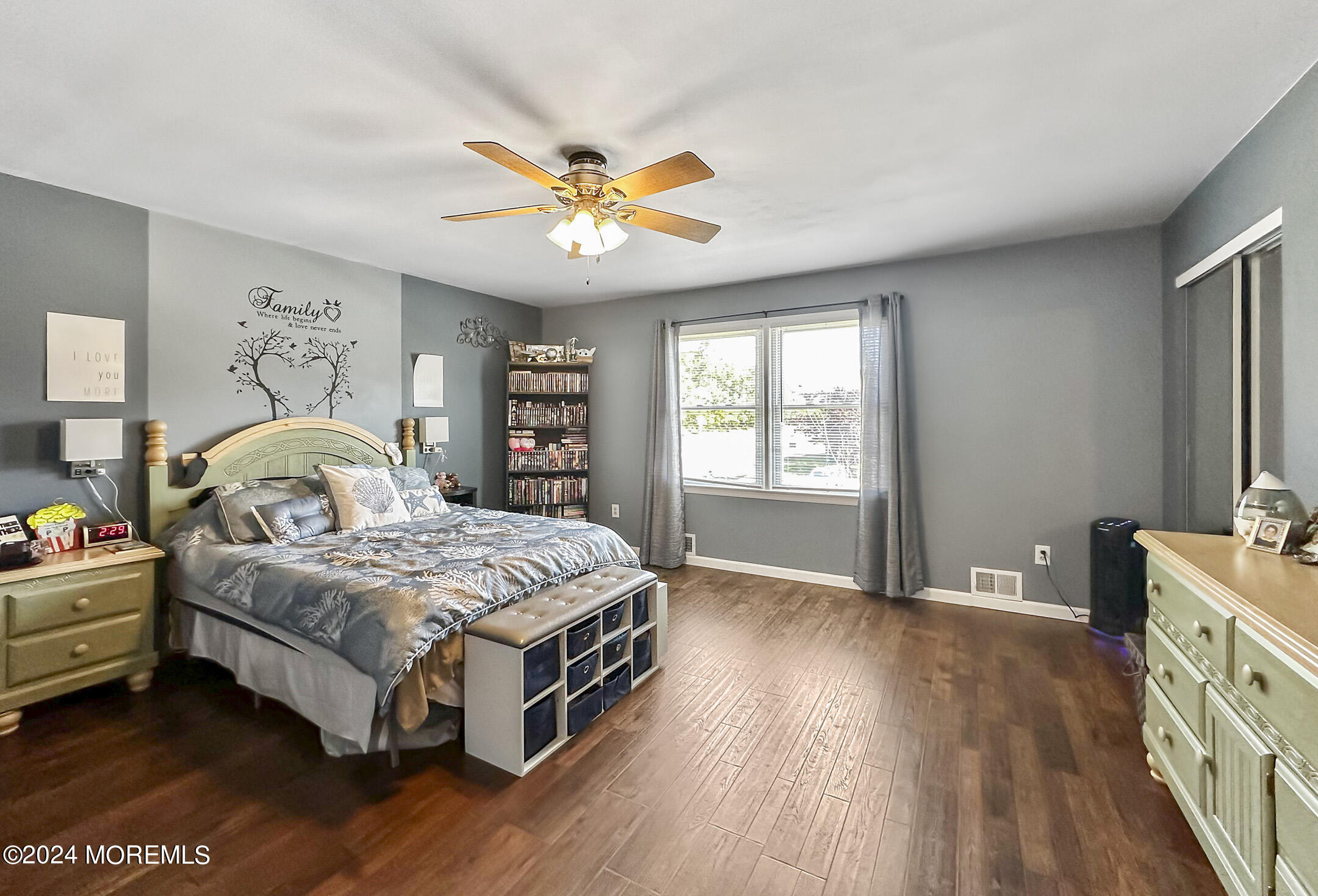 1002 Sawmill Road Brick, NJ 08724 - Photo 15 of 27 a bedroom with a bed and a chandelier