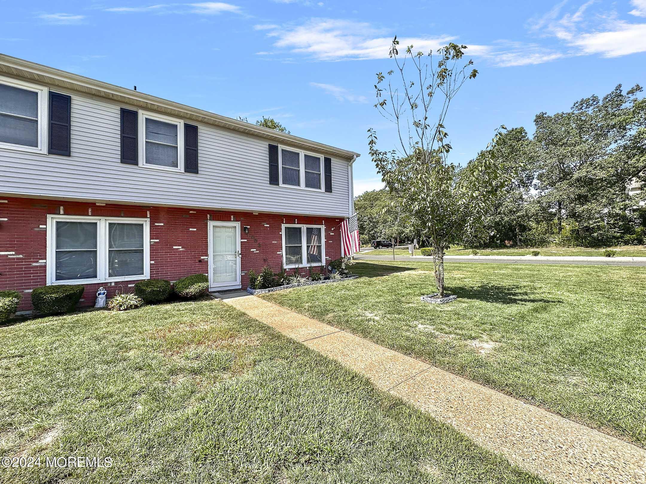 1002 Sawmill Road Brick, NJ 08724 - Photo 2 of 27 a front view of a house with a yard