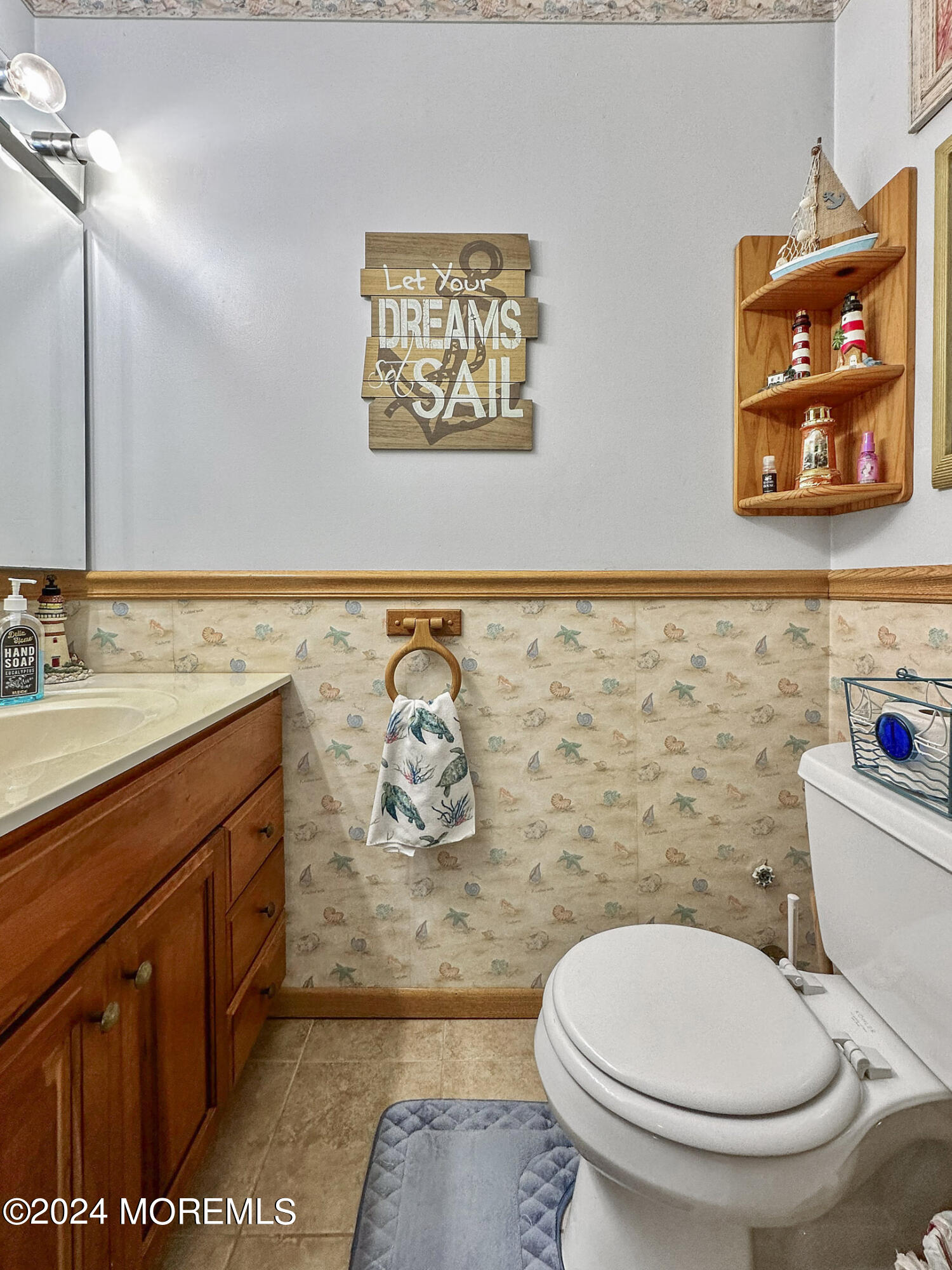 1002 Sawmill Road Brick, NJ 08724 - Photo 21 of 27 a bathroom with a toilet a sink and a mirror