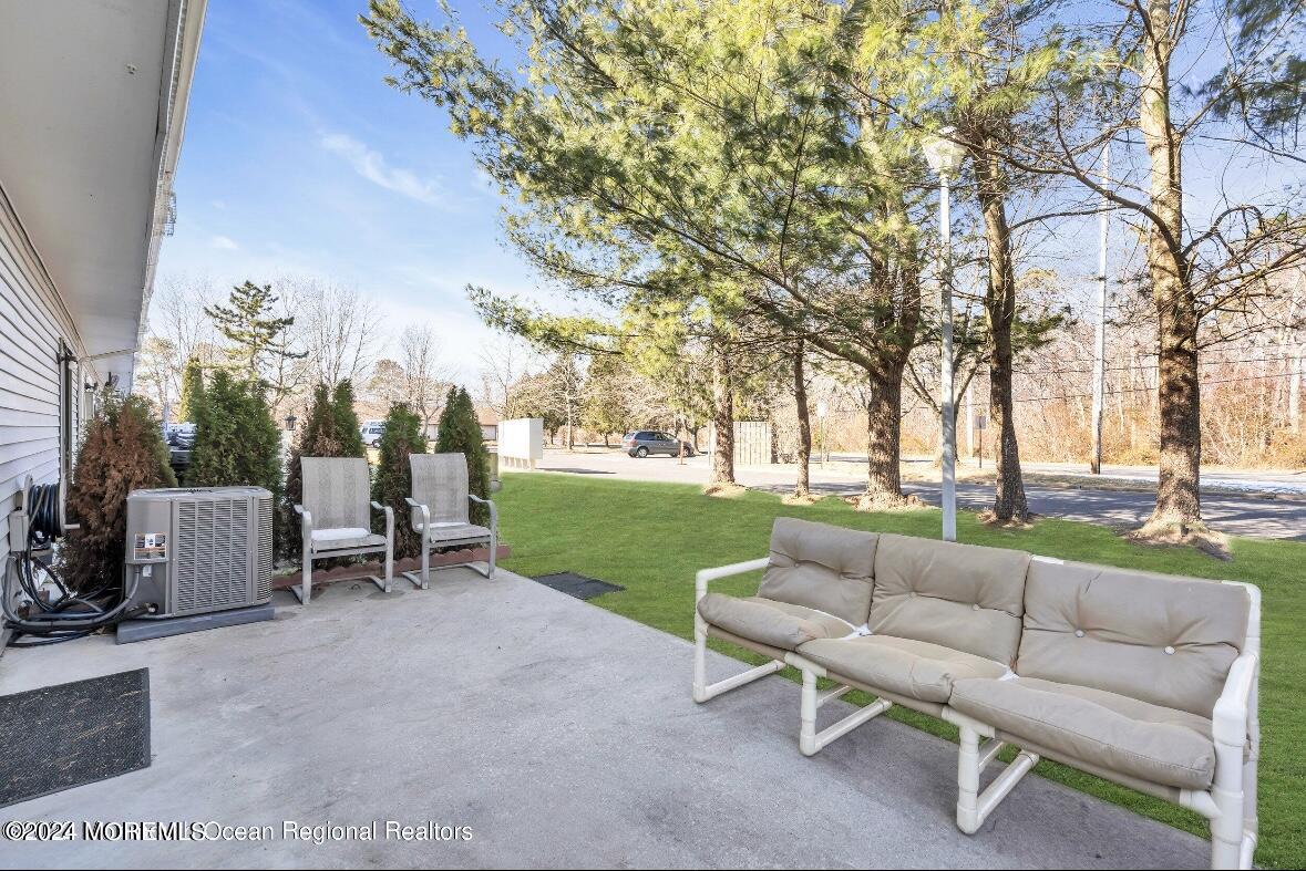 1002 Sawmill Road Brick, NJ 08724 - Photo 24 of 27 a view of a patio with couches and a big yard