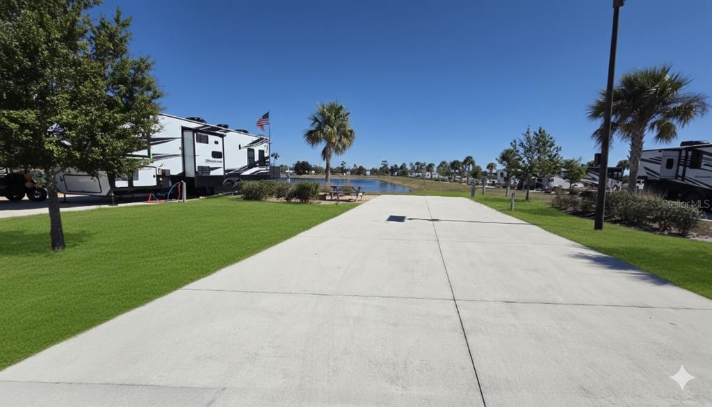 115 Rhett Blvd Lake Lake Wales, FL 33898 - Photo 1 of 1 a view of yard with swimming pool and tall trees