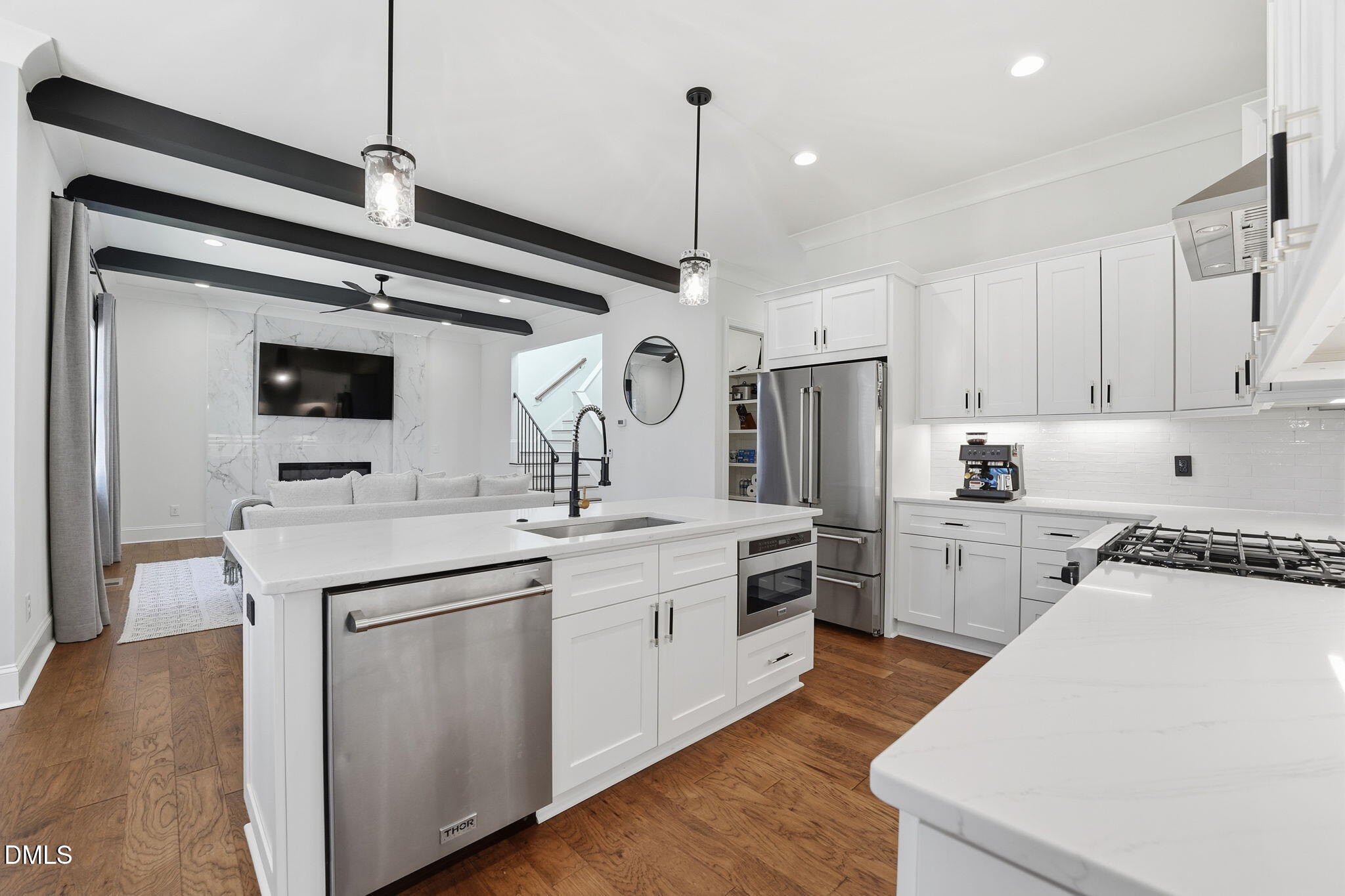 100 North Ridge View Way Franklinton, NC 27525 - Photo 3 of 25 a kitchen with white cabinets stainless steel appliances and wooden floor