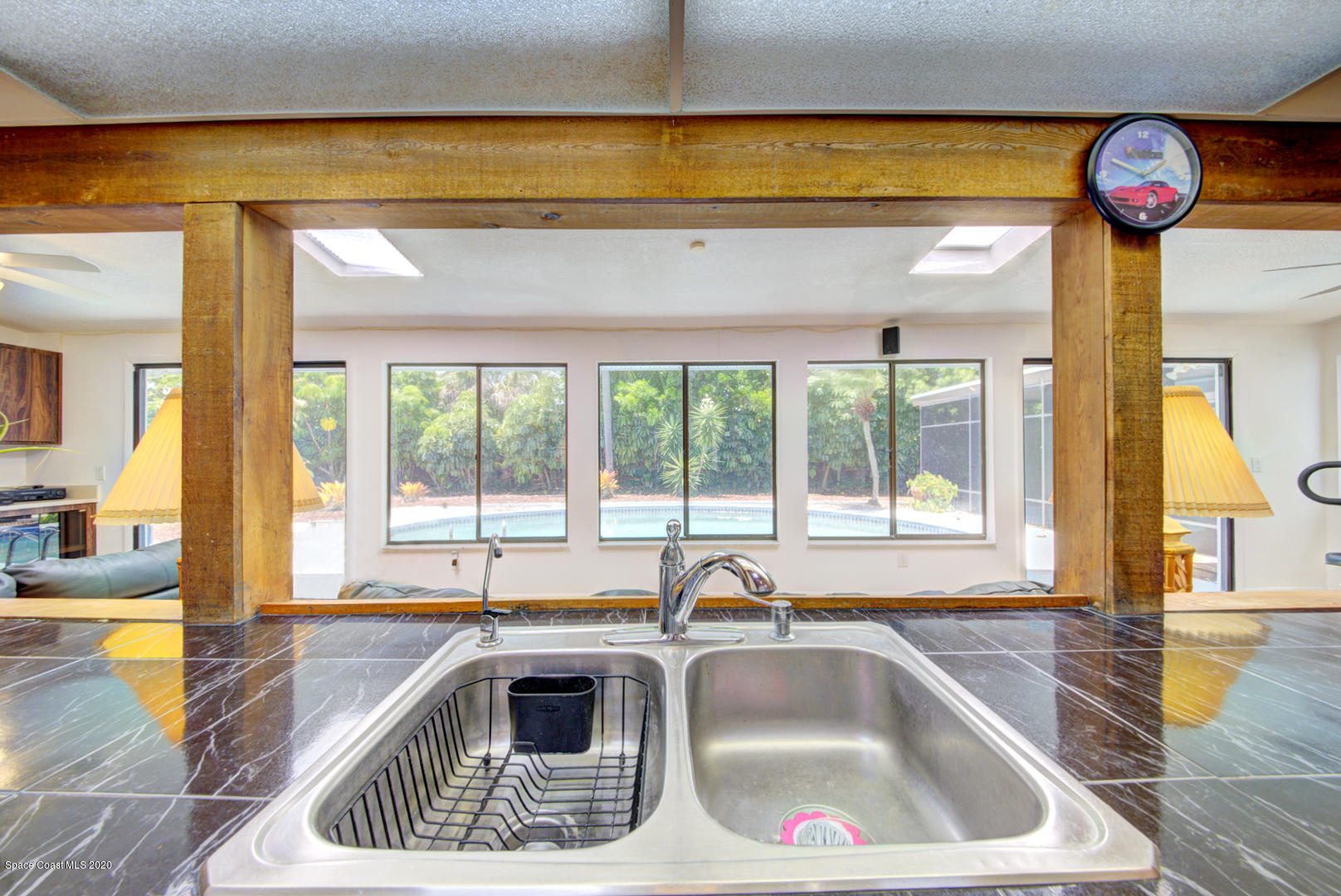 182 Sand Pine Road Indialantic, FL 32903 - Photo 9 of 56 Kitchen Sink with Pool View