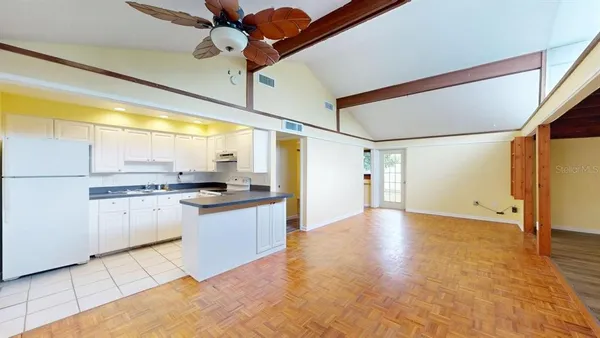 a kitchen with stainless steel appliances granite countertop a sink and cabinets