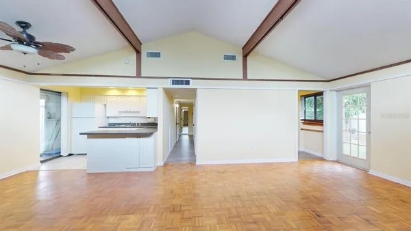 a view of an empty room with glass door