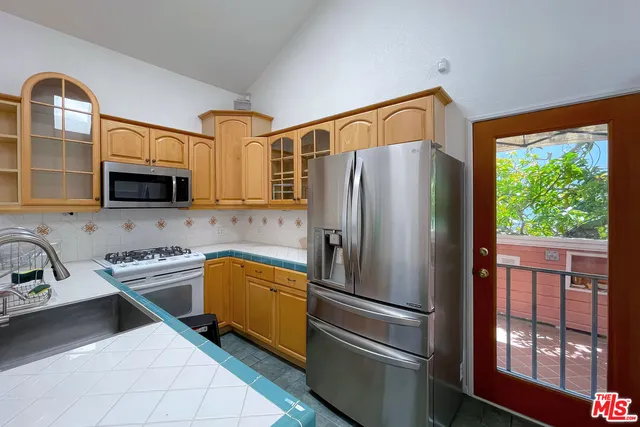 a bathroom with a shower and a sink