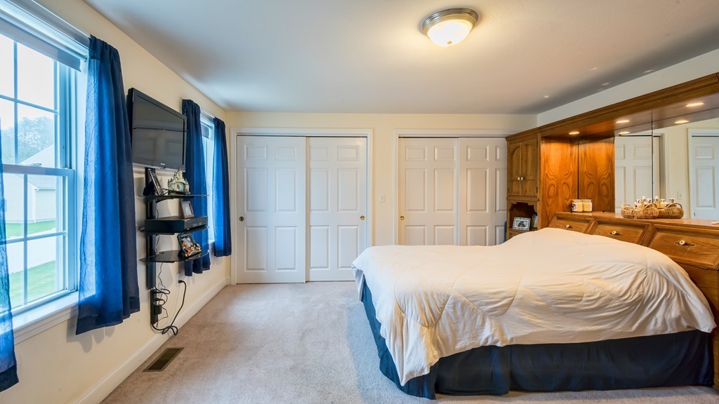 263 Forest Street Methuen, MA 01844 - Photo 11 of 18 a bedroom with a bed and a large window