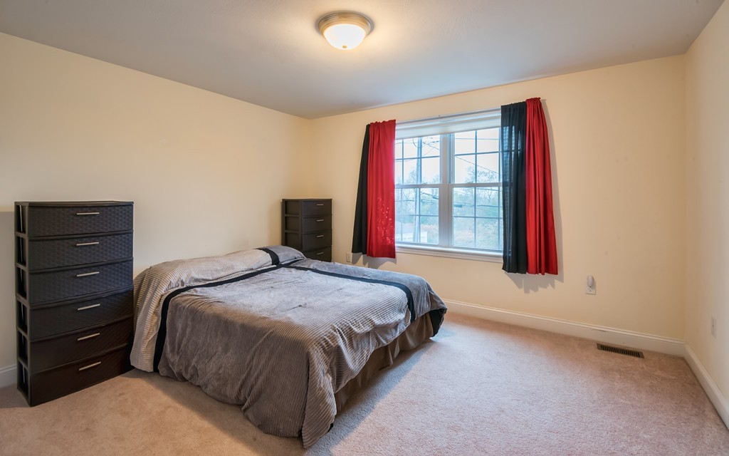 263 Forest Street Methuen, MA 01844 - Photo 14 of 18 a bedroom with a bed and a window