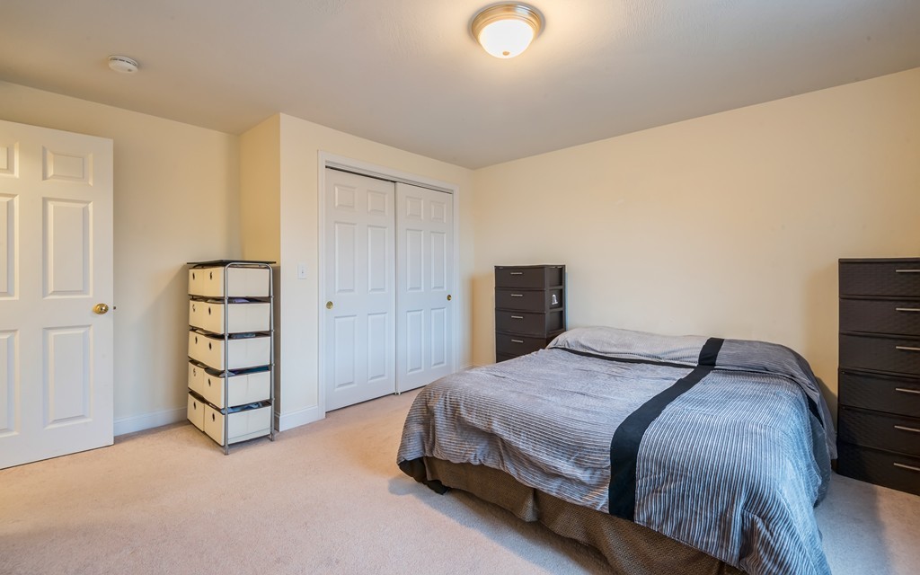263 Forest Street Methuen, MA 01844 - Photo 15 of 18 a bedroom with a bed and a closet