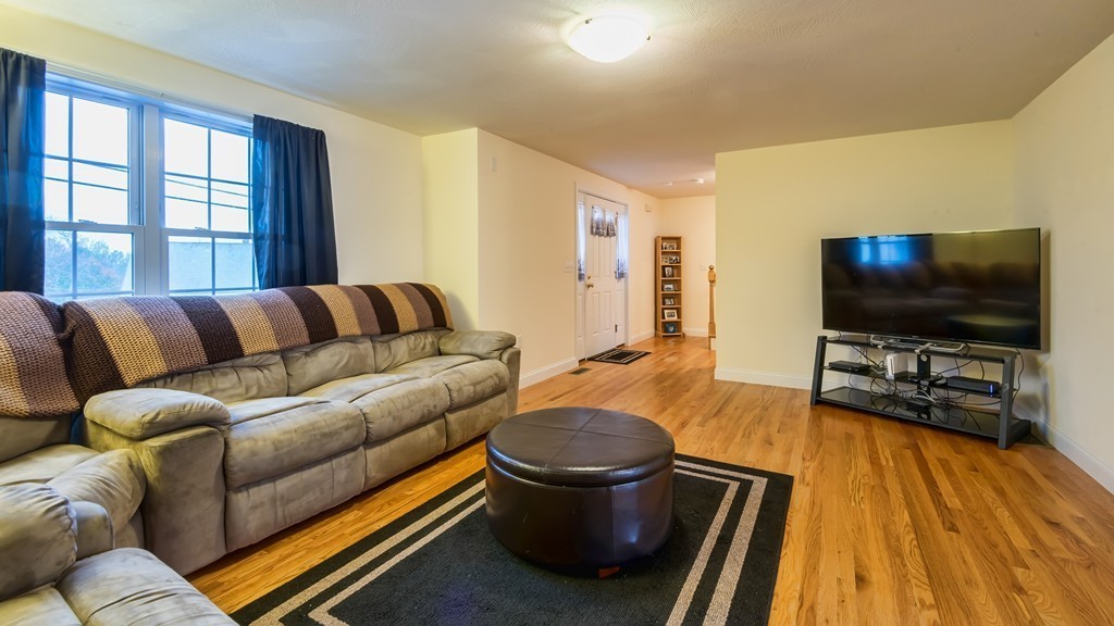 263 Forest Street Methuen, MA 01844 - Photo 3 of 18 a living room with furniture and a flat screen tv