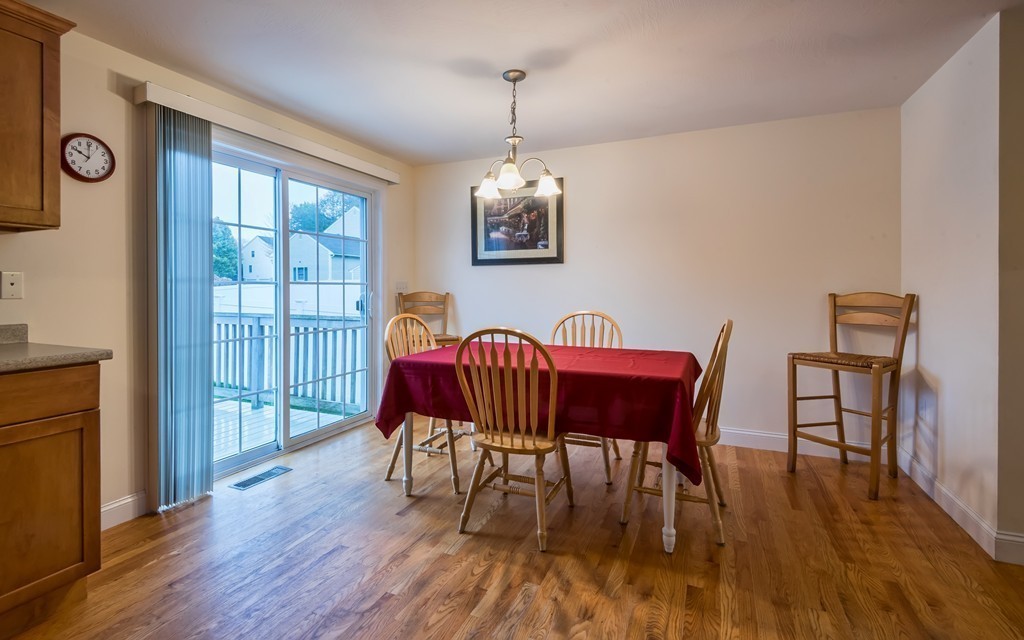 263 Forest Street Methuen, MA 01844 - Photo 5 of 18 a view of a dining room with furniture window and wooden floor