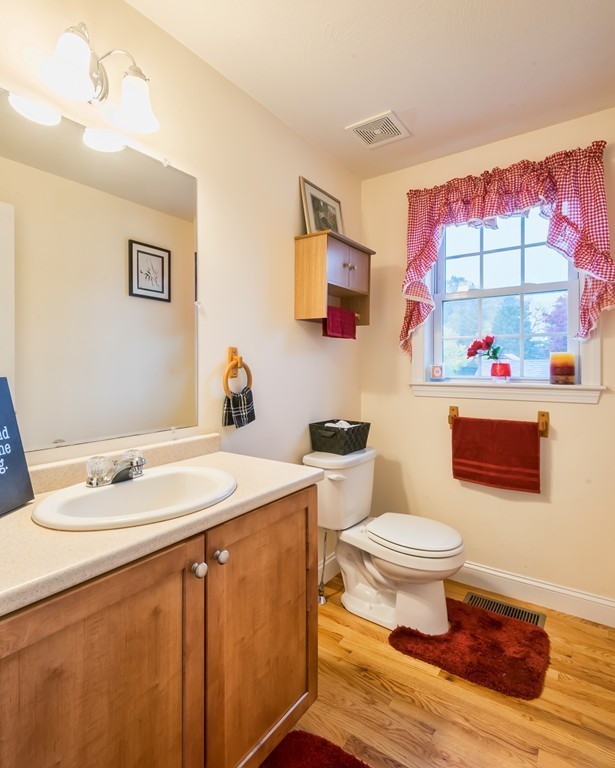 263 Forest Street Methuen, MA 01844 - Photo 7 of 18 a bathroom with a sink toilet vanity and tub