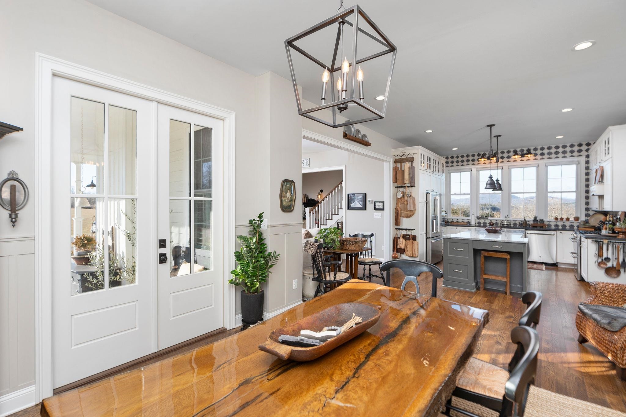 10 Cora Lane Lexington, VA 24450 - Photo 15 of 74 a view of a dining room and livingroom with furniture wooden floor a chandelier