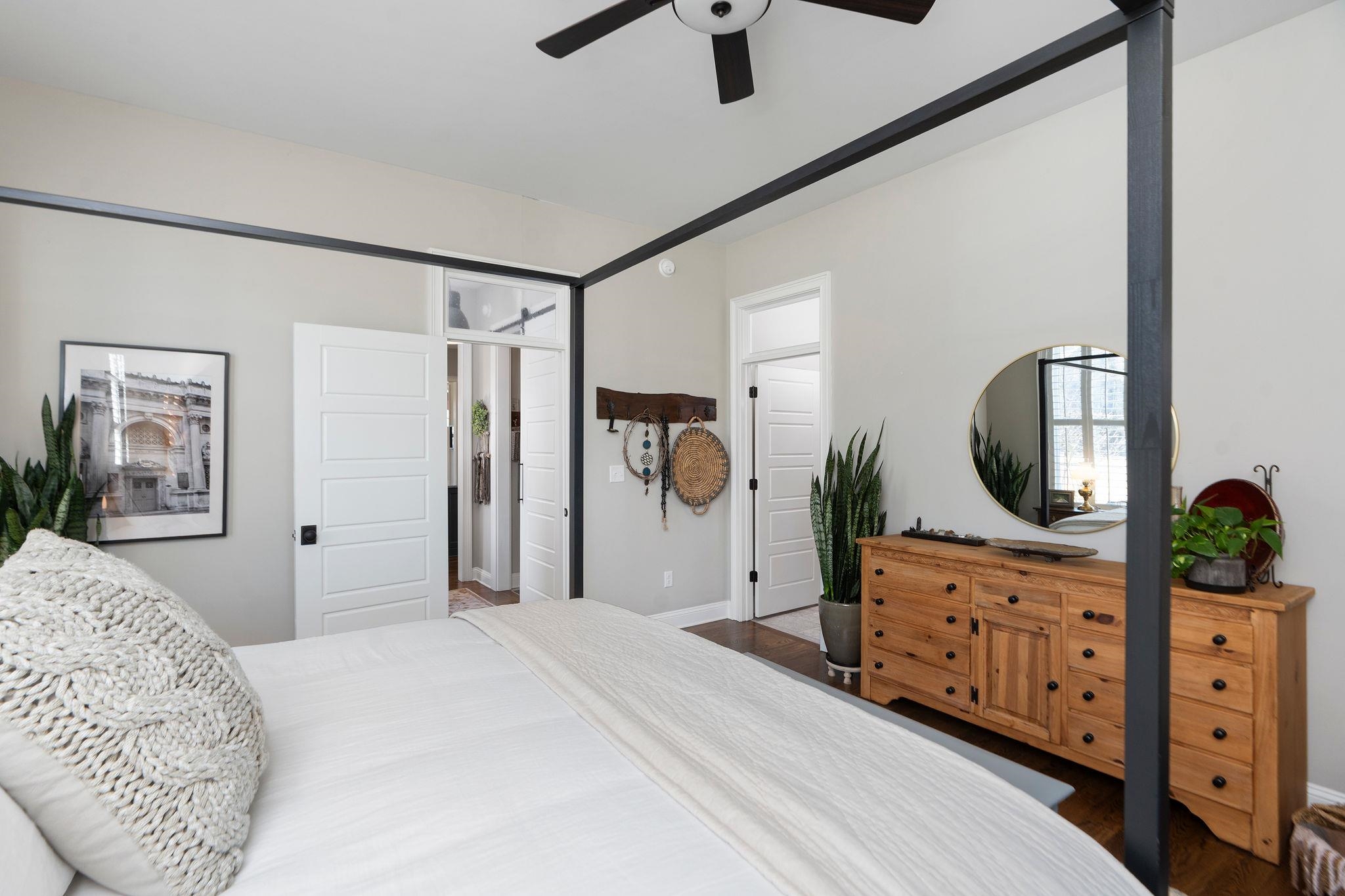 10 Cora Lane Lexington, VA 24450 - Photo 28 of 74 a bedroom with a bed a dresser and potted plants