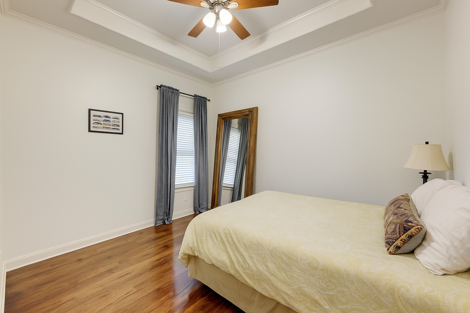 1010 Nicholson Street Houston, TX 77008 - Photo 21 of 28 a bedroom with a bed and a chandelier