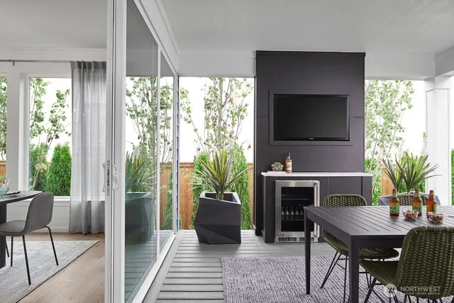 a living room with furniture and a large window