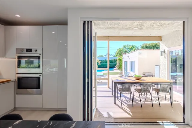 a white bath tub sitting next to a white toilet