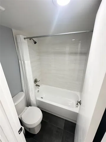 a view of wooden floor in an empty room