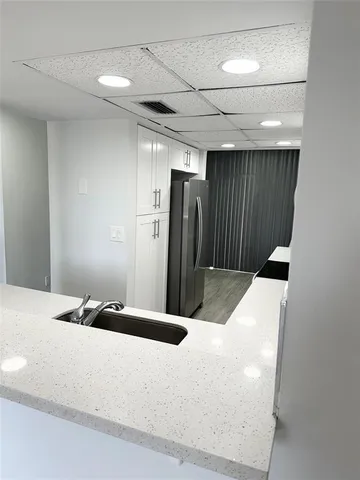 a bedroom with a bed and a shower