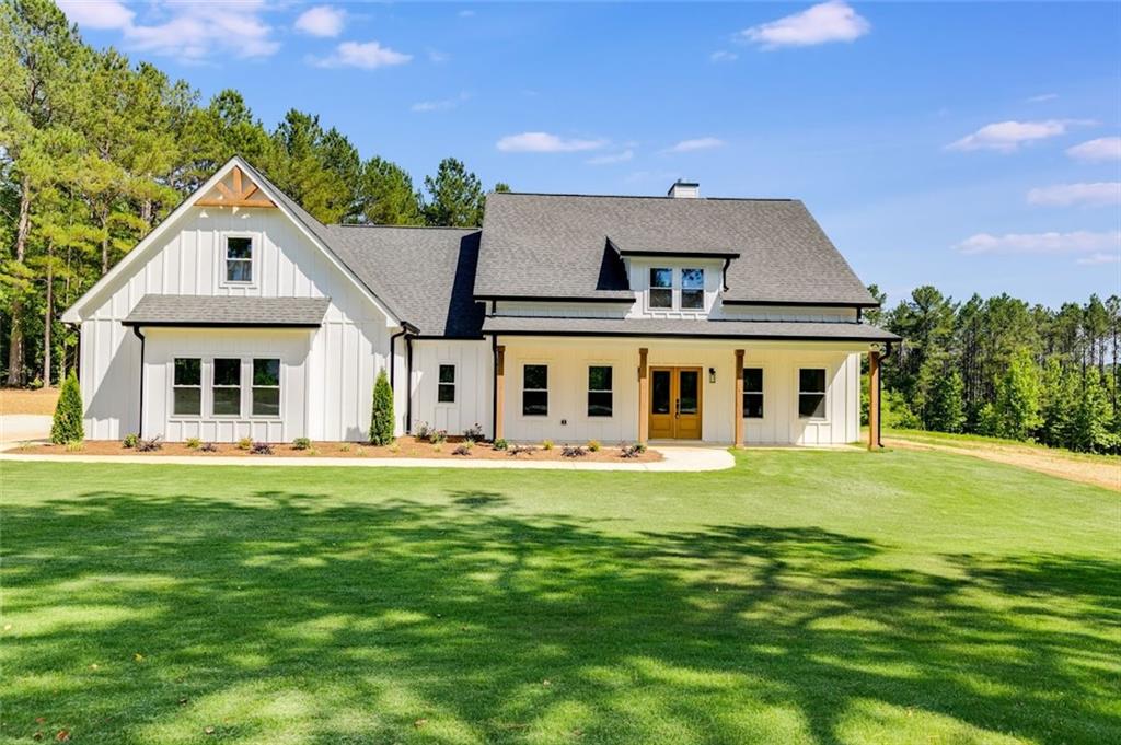 1645 McGarity Road Temple, GA 30179 - Photo 1 of 1 a front view of a house with a garden