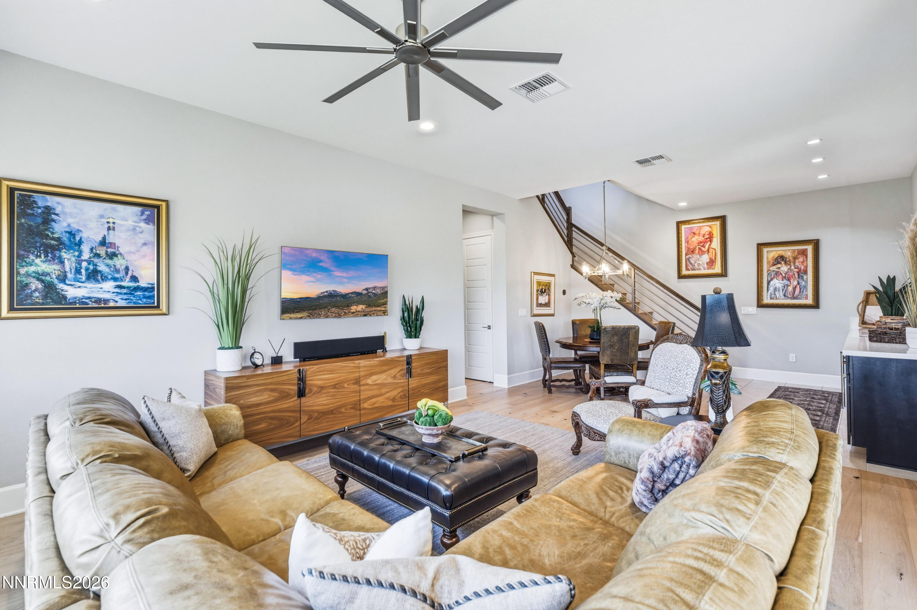 9028 Iron Sky Court Reno, NV 89523 - Photo 22 of 36 a living room with furniture and a flat screen tv