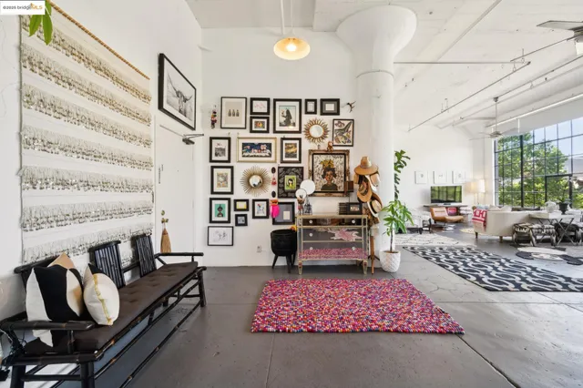 a living room with furniture and a rug