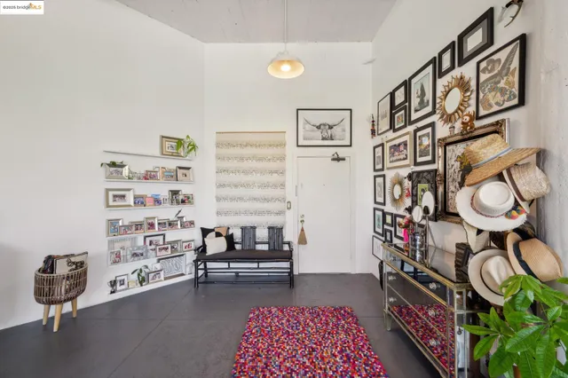 a view of a livingroom with furniture and staircase
