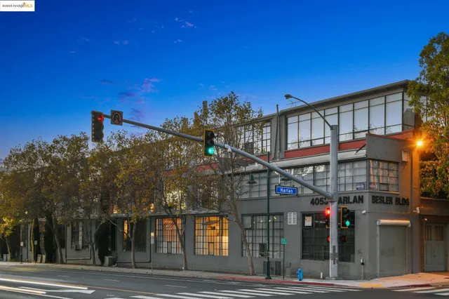 a yellow building sitting in front of a building