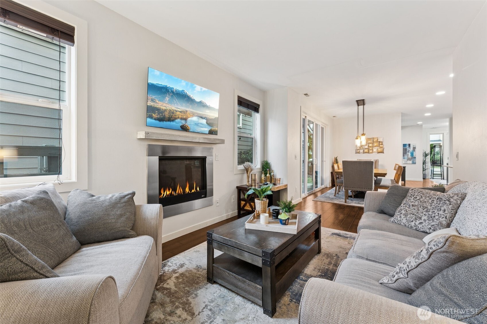 845 Southwest 96th Place Seattle, WA 98106 - Photo 13 of 24 a living room with furniture a fireplace and a large window