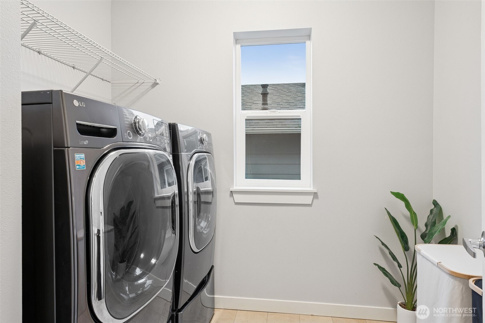 845 Southwest 96th Place Seattle, WA 98106 - Photo 19 of 24 a utility room with mirror and shower