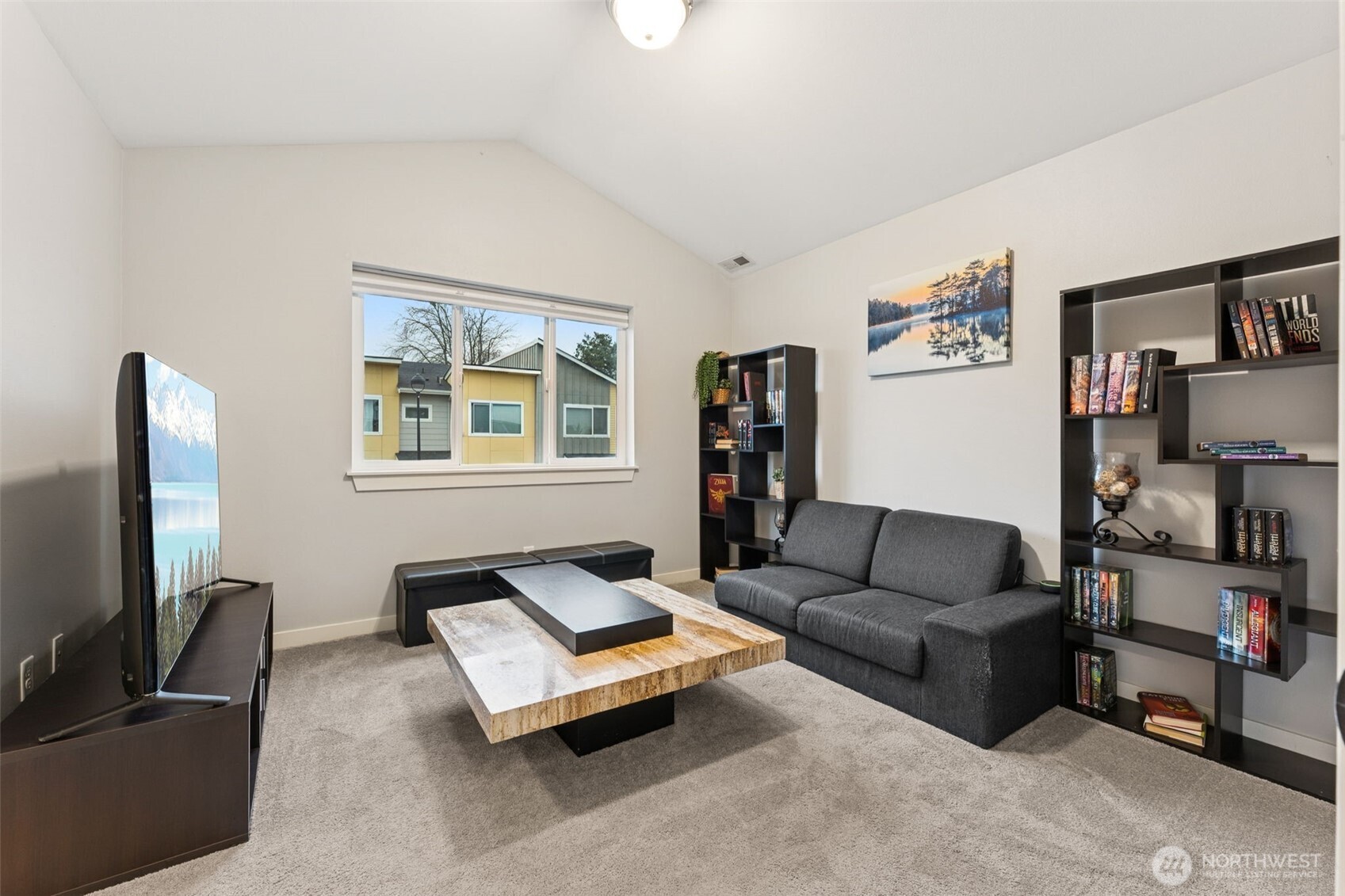845 Southwest 96th Place Seattle, WA 98106 - Photo 22 of 24 a living room with furniture and a flat screen tv