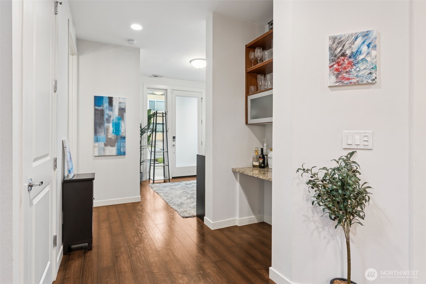 845 Southwest 96th Place Seattle, WA 98106 - Photo 3 of 24 a view of a hallway with wooden floor and a potted plant