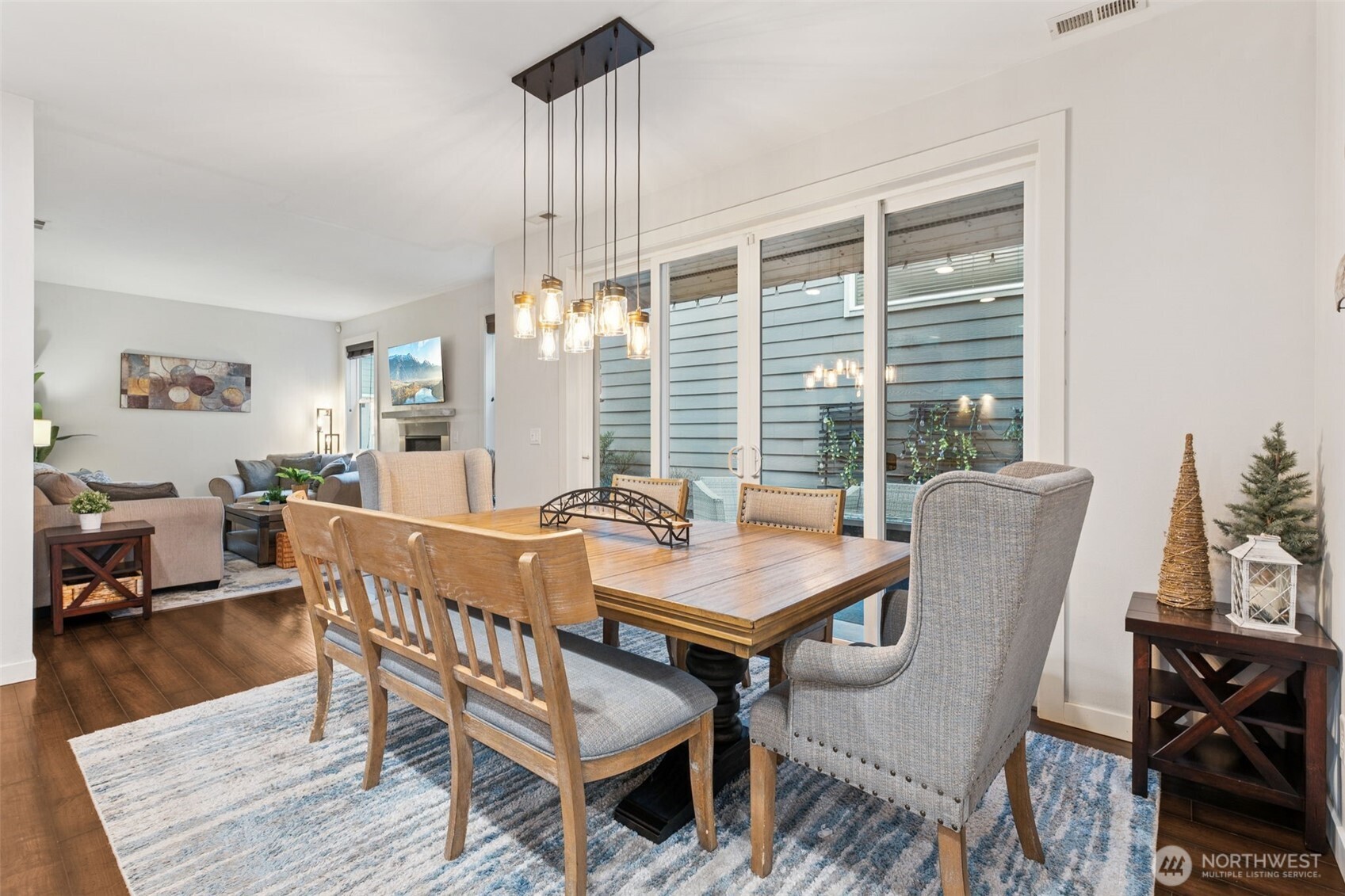 845 Southwest 96th Place Seattle, WA 98106 - Photo 10 of 24 a dining room with furniture a chandelier and wooden floor