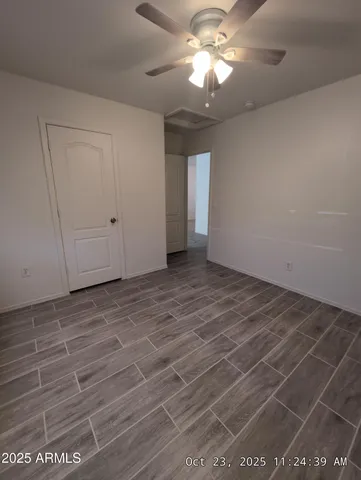 a view of an empty room with a window