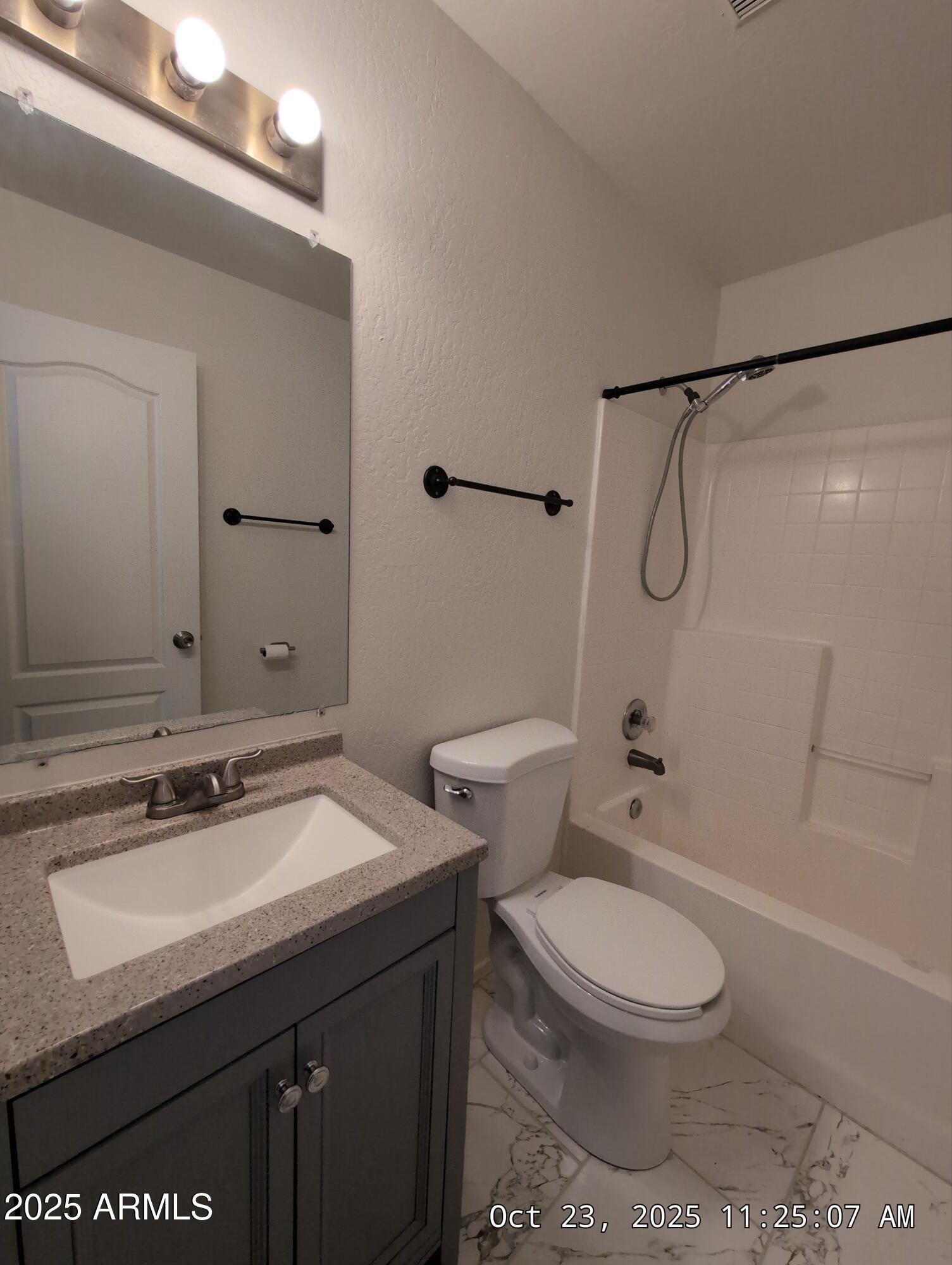 9978 West Century Drive, Unit B Arizona City, AZ 85123 - Photo 9 of 11 a bathroom with a sink a toilet and shower