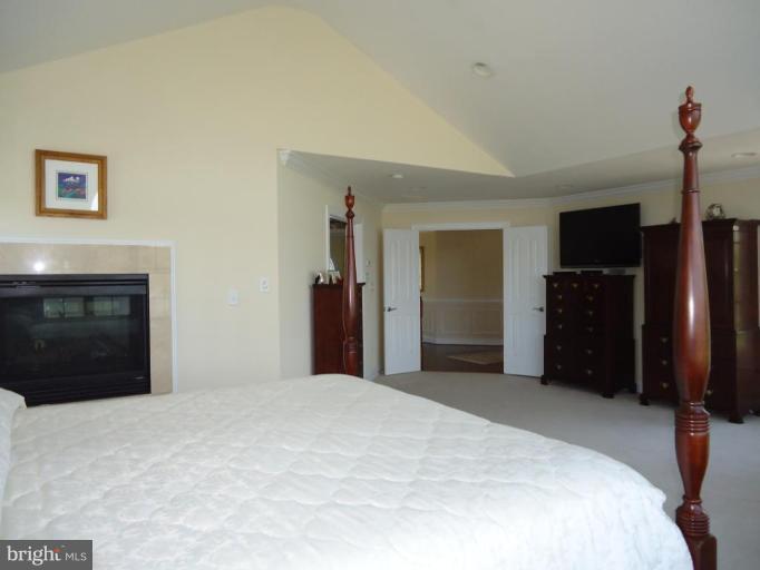 230 Bentons Pleasure Road Chester, MD 21619 - Photo 16 of 30 a bedroom with a bed and a television