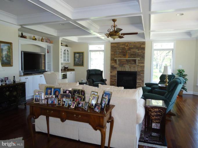 230 Bentons Pleasure Road Chester, MD 21619 - Photo 24 of 30 a living room with fireplace furniture and a flat screen tv