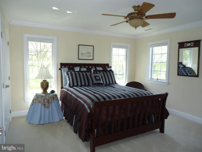 230 Bentons Pleasure Road Chester, MD 21619 - Photo 26 of 30 a bedroom with a bed and window