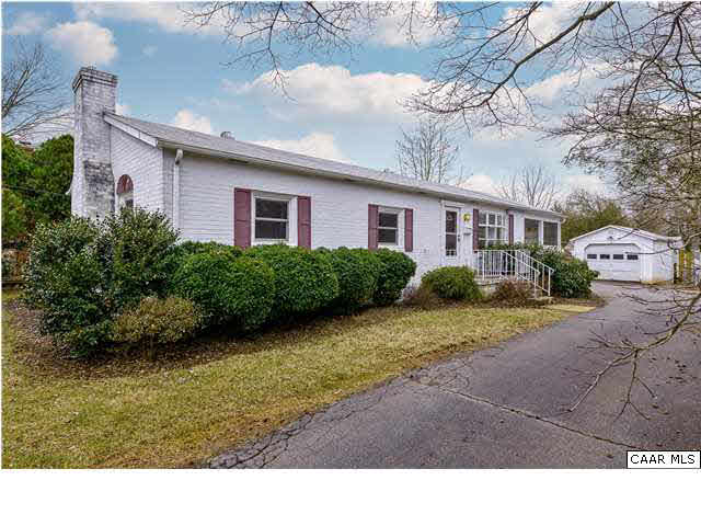 1144 Meriwether Street Charlottesville, VA 22902 - Photo 1 of 18 a black and white photo of a house with a yard