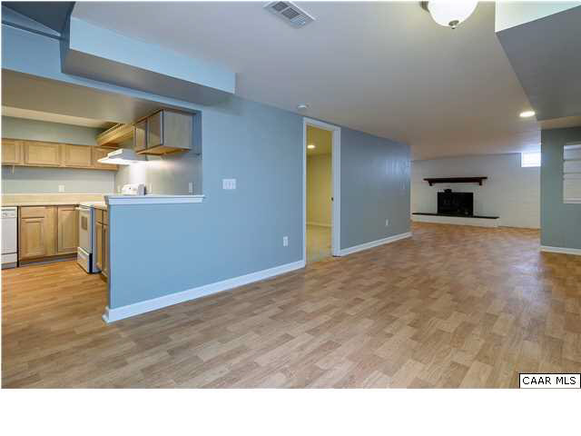 1144 Meriwether Street Charlottesville, VA 22902 - Photo 11 of 18 a open kitchen with a stove and a refrigerator